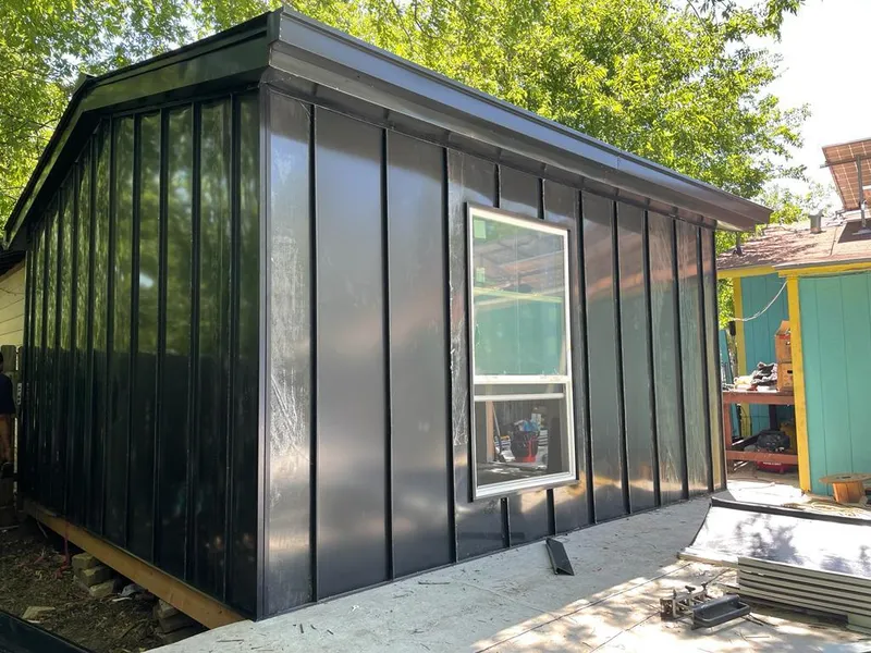 Black standing seam metal wall panels for Roof Inspection in Wallington